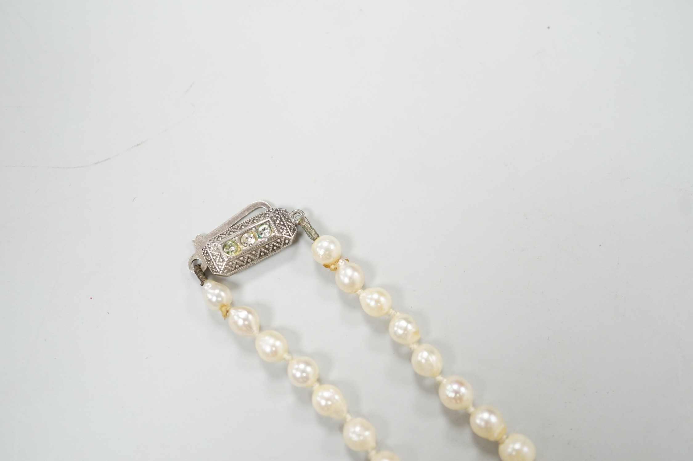 A single strand culture pearl necklace, with paste set sterling clasp, 38cm.